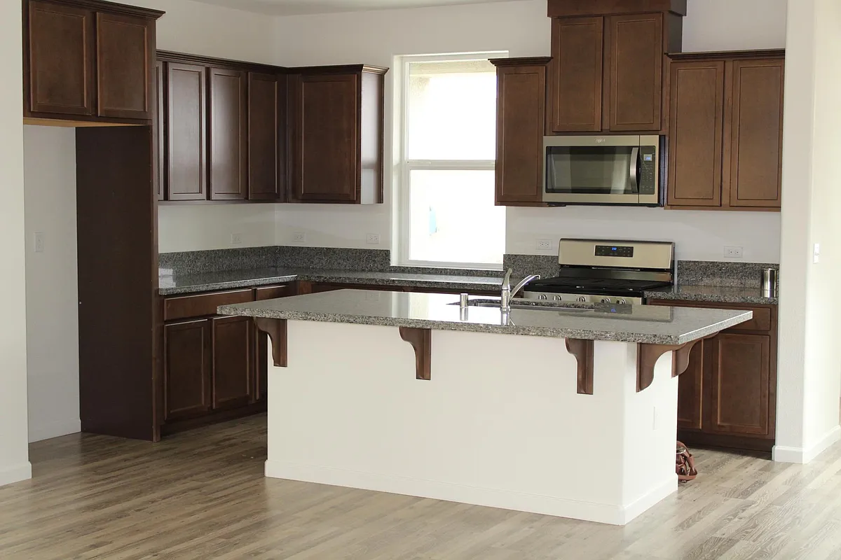 New kitchen complete with microwave over range, dishwasher, pantry and bar seating. - 2213 S Aubree St