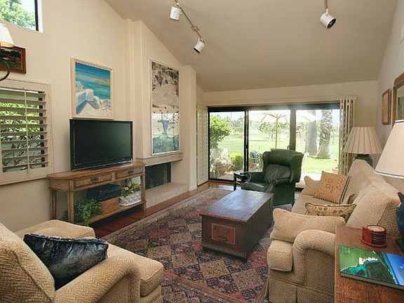 Dramatic high ceilings in the living room with views to the golf course