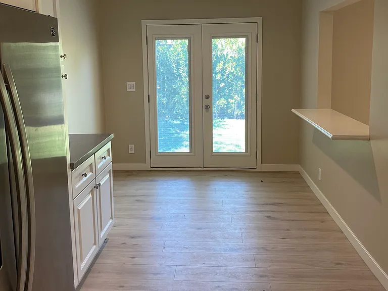 French door access / Breakfast Area / Counter top can seat two Pull-up stools