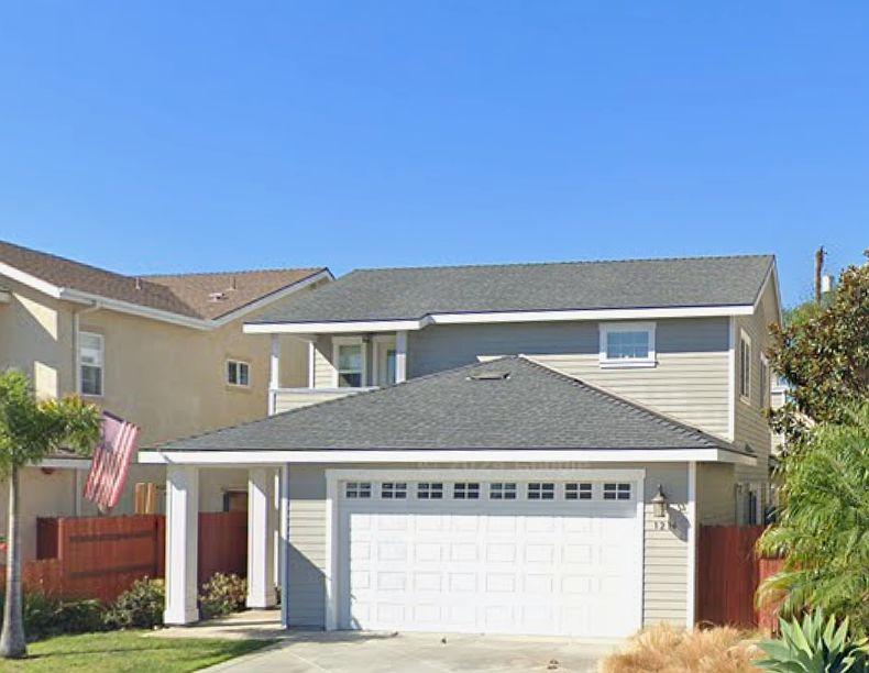 Beautiful two story home with large garage and well manicured lawn!