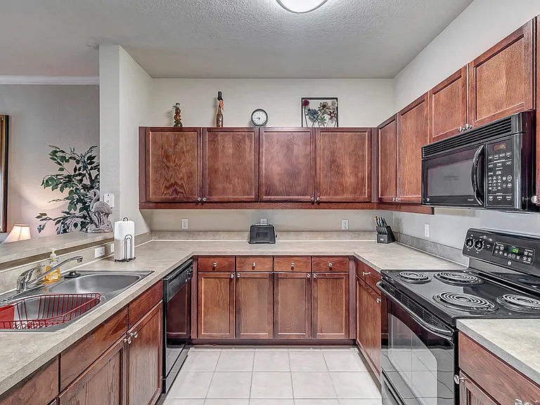 Kitchen with Black Appliances & Tile Floors