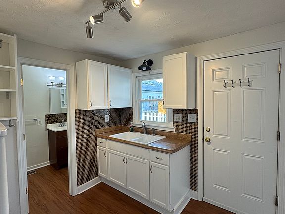 All new lighting and freshly remodeled, door goes to side porch and private drive