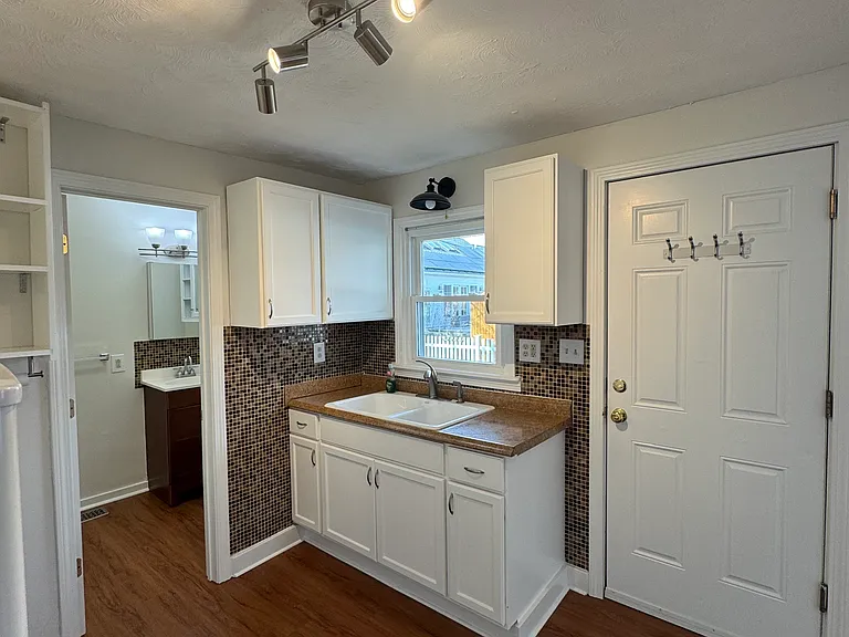 All new lighting and freshly remodeled, door goes to side porch and private drive
