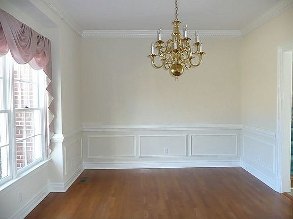 Formal Dining Room with Picture Molding, Double Crown, Chair Rail & HW Floors