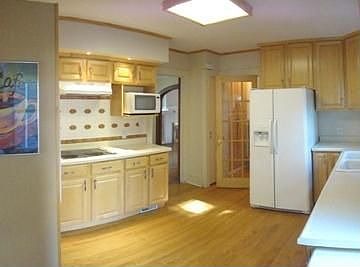 Updated kitchen with hardwood floors and a double oven. All appliance stay.