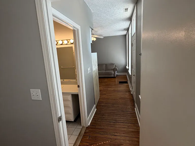 Looking from bedroom toward living room/ kitchen combo