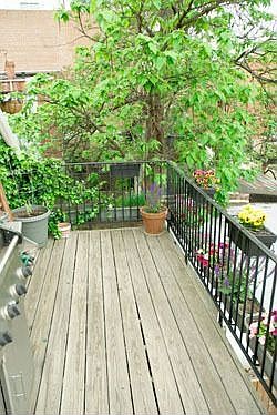 Back deck with attached flower garden & watering system.