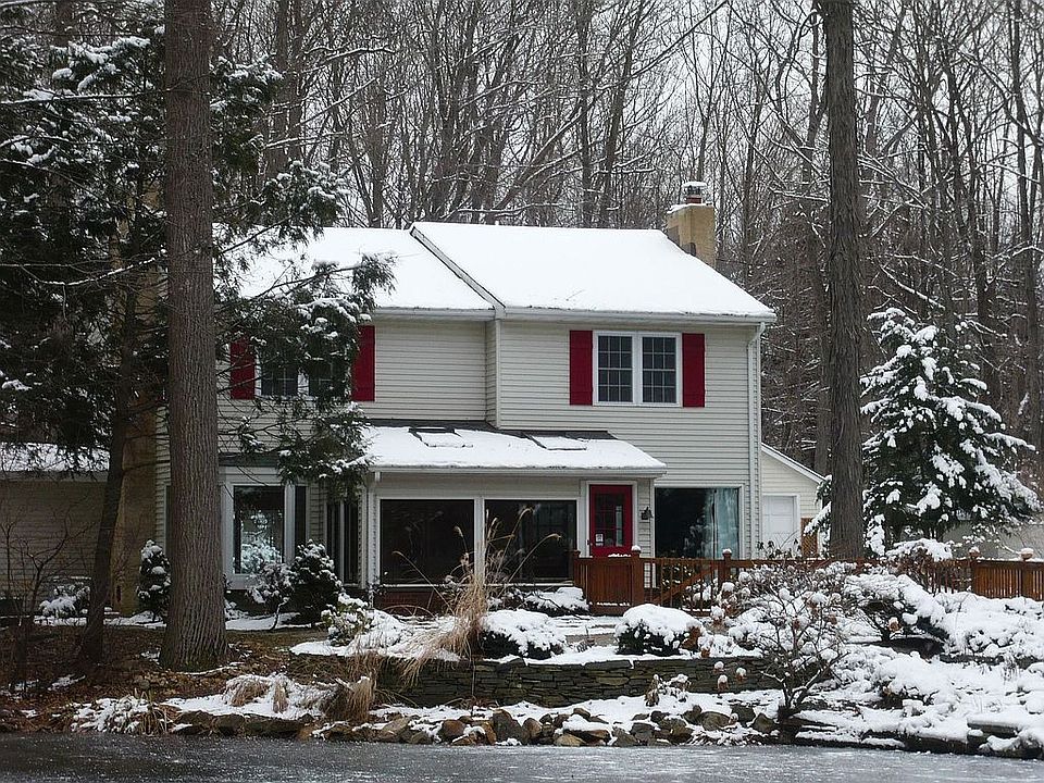 Nestled on 2+ Wooded and Open Acres with a Pond!