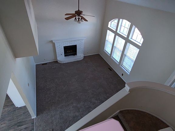 Large living area opens to dining room and kitchen. New carpet.
