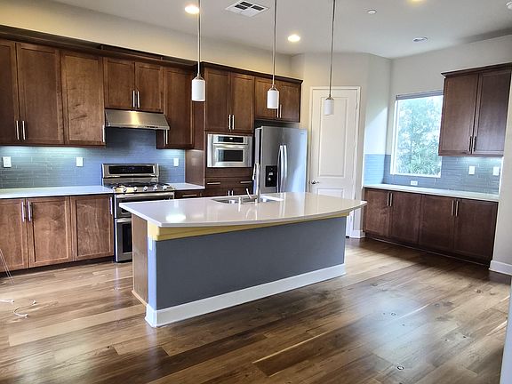 Newly refinished natural wood flooring