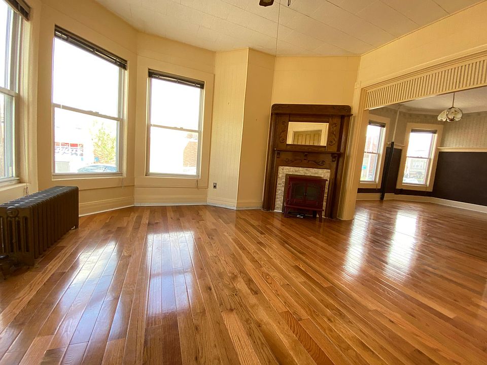 Bright spacious living room with windows.
