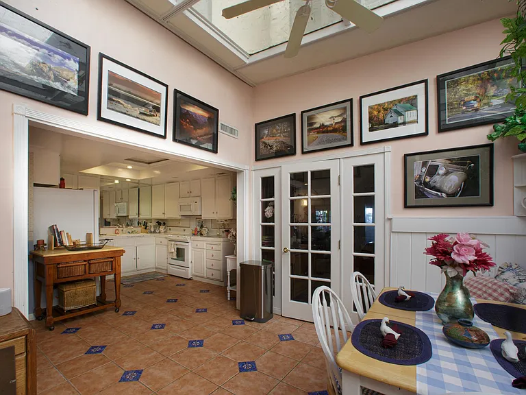 View from the atrium's skylit breakfast nook into the kitchen