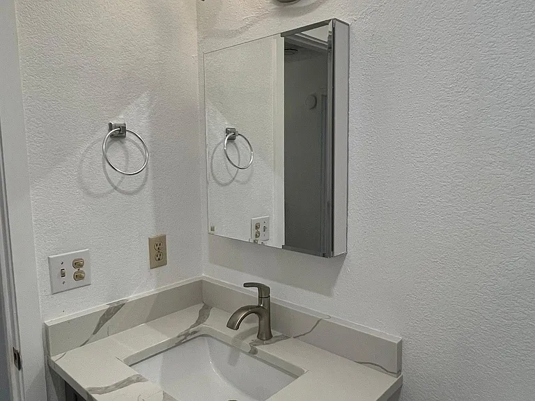 Bathroom upstairs with medicine cabinet