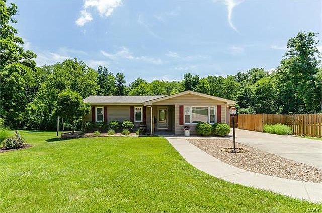 Absolutely adorable 3 bed home on .93 acres with a OS 4 car tandem garage.