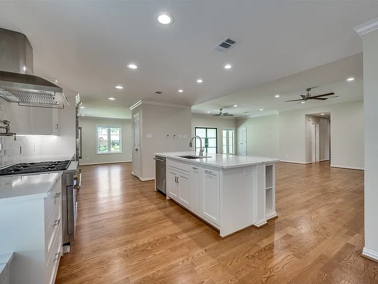 Kitchen opens to dining room (left), family room (right)