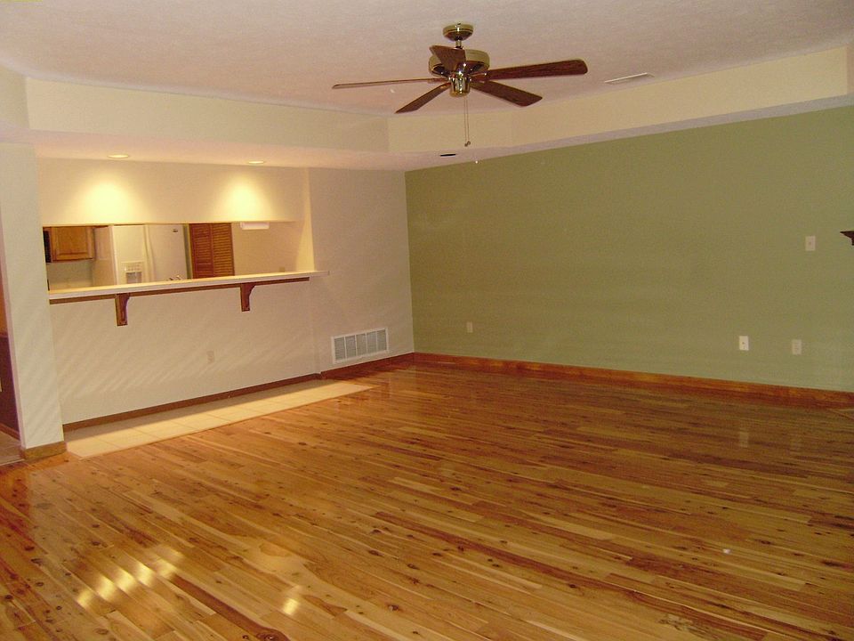 Beautiful Australian Cypress solid hardwood floors throughout living room.