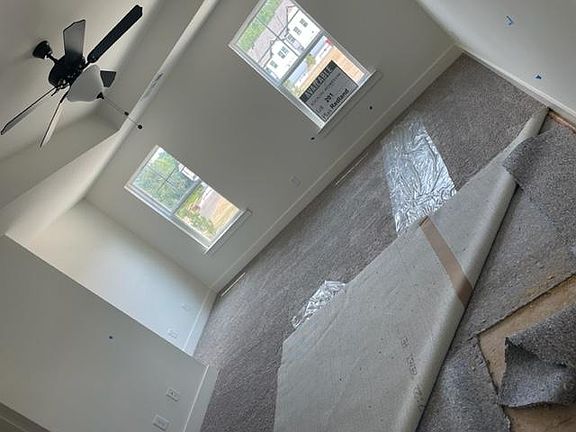 Master bedroom with trey ceiling and sitting area/office at windows