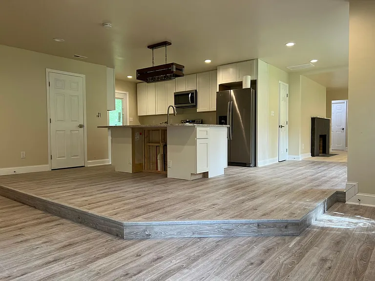 Chef's kitchen with oversized island, stainless appliances, and walk-in pantry _ perfect for cooking and entertaining.