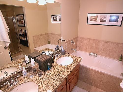 Great master bath with double sinks and large roman tub