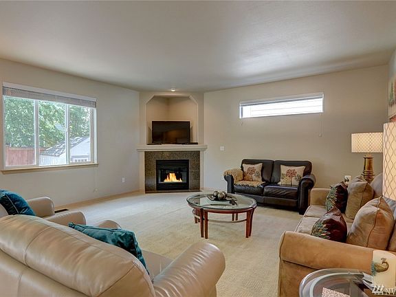 Another shot of the great room with gas fireplace, high ceilings and lots of light.