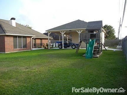 Backyard : Large backyard with Shop and covered patio.