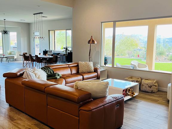 Living room with large windows and mountain views