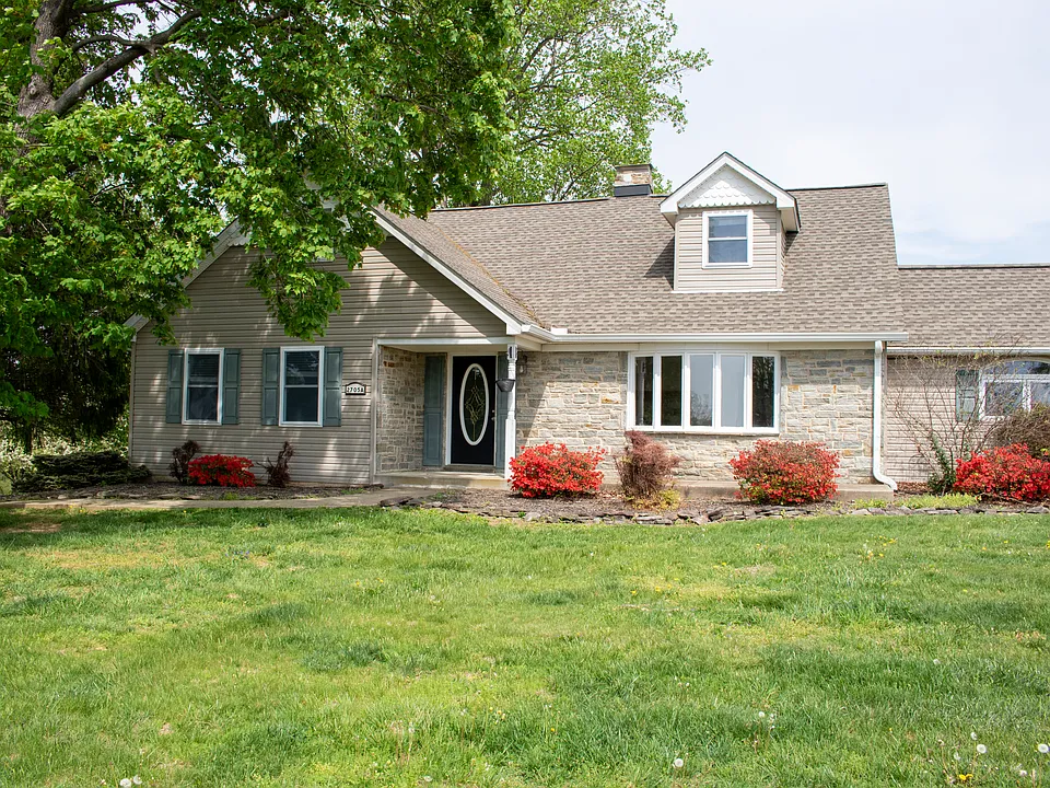 Front of house with concrete porch