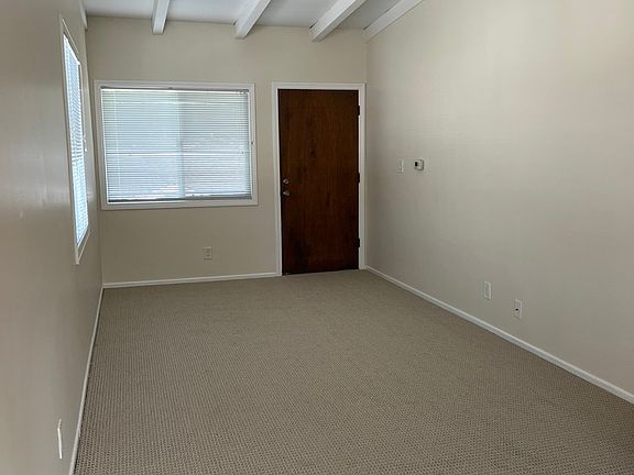 Living room updated with new paint and carpet.