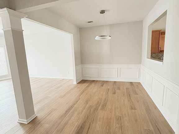 Dining area with opening into kitchen.