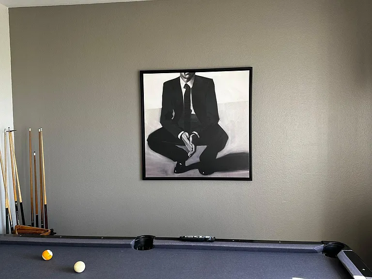 Game area with pool table and darts.
