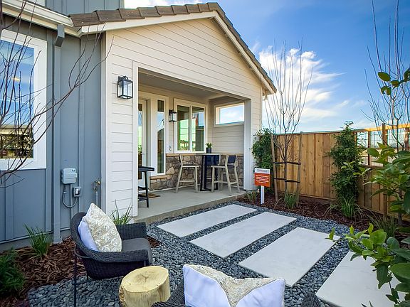 A secluded outdoor retreat, this private patio offers a perfect blend of comfort and tranquility.