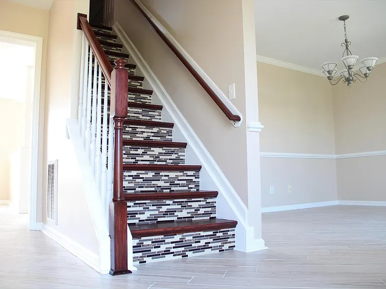 Beautiful tile stairs and Mahogany steps and rails.
