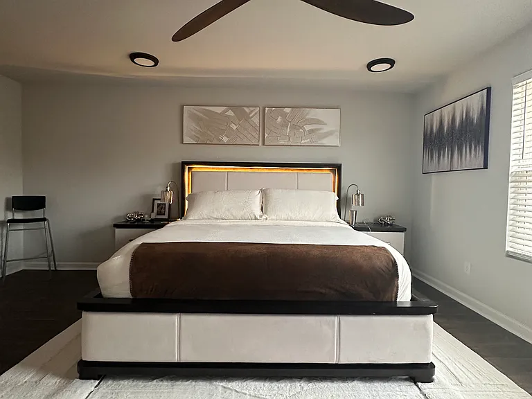 Master bedroom with ceiling fan and 4 luxury flush mount ceiling fixture.