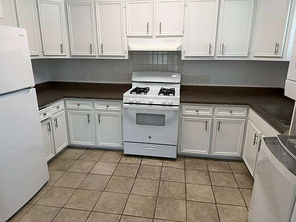 Kitchen with washer and dryer