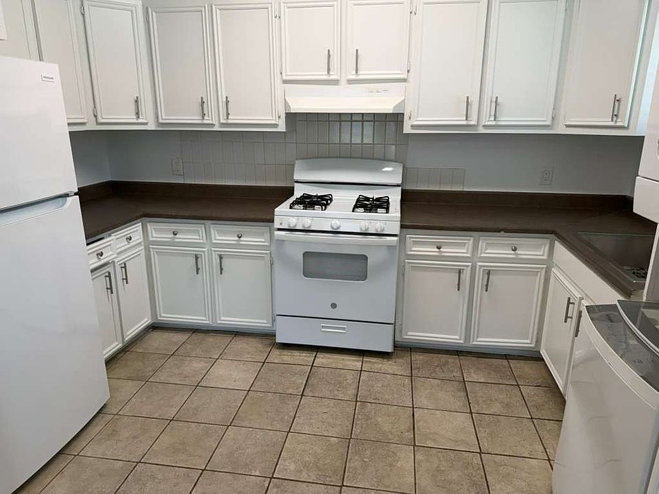 Kitchen with washer and dryer