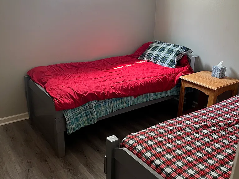 Second bedroom with a closet, new floors, new paint.