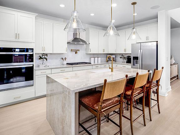 Expansive kitchen with optional waterfall edge island