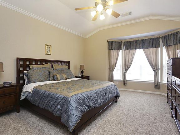MASTER BEDROOM [16X14] The master retreat is located on the first floor and overlooks the lovely backyard. High ceilings and new carpet are sure to please.