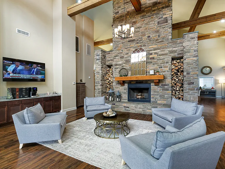 Clubhouse resident lounge with fireplace and coffee bar