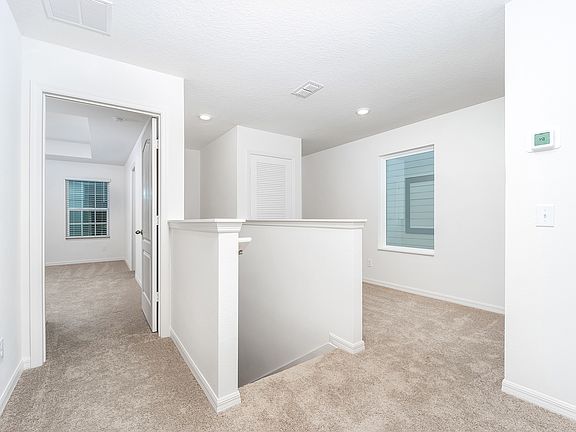 The upstairs loft is perfect for an office or playroom