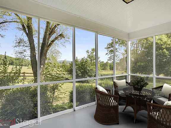 SIDE PORCH - STAGED.. READY FOR YOUR FURNITURE