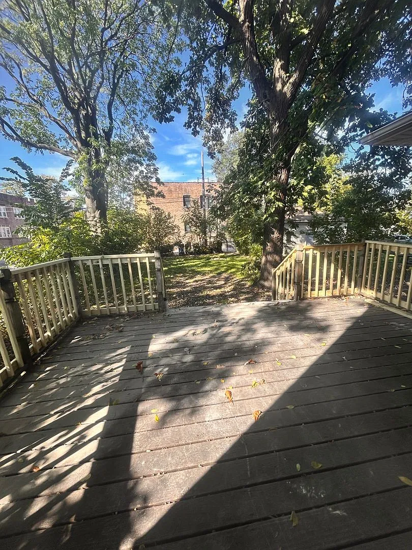 3-Bedroom Corner Home with Hardwood Floors, Sunroom, and Fenced Backyard — Photo 3