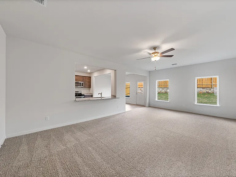 The open layout connects the family room with the kitchen and dining room.