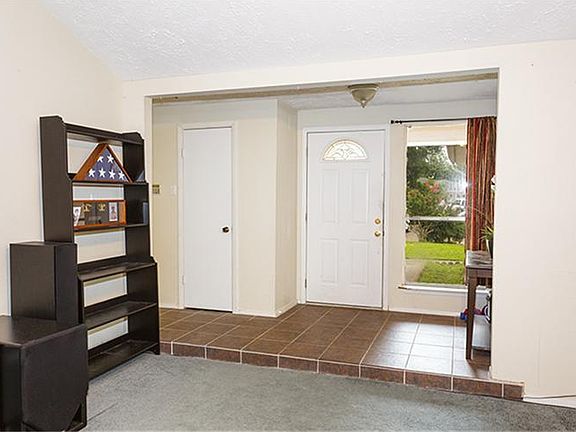 Entry has updated ceramic tile flooring