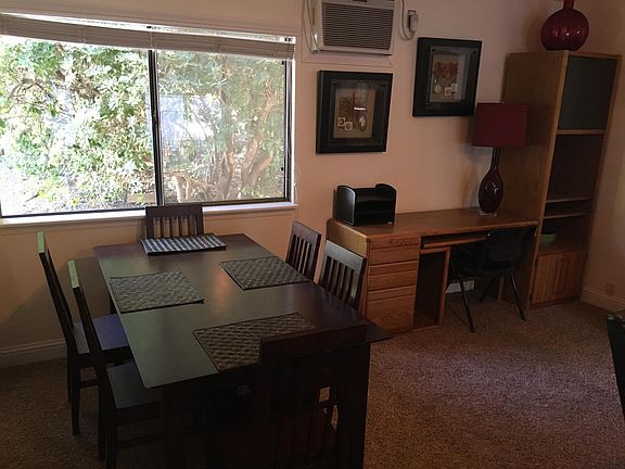 Dining table and desk with file drawers.