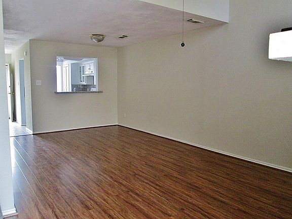 Wood Laminate Flooring was Just Installed. Kitchen is open to the Dining and Den Area. 13x11 Den has