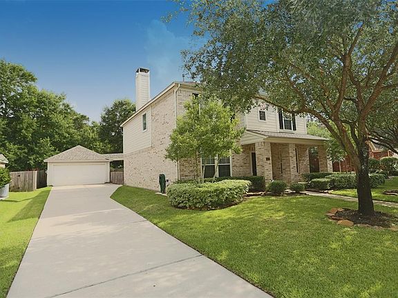 Beautiful mature oak tees in the front yard. Detach garage, LONG driveway for more parking.