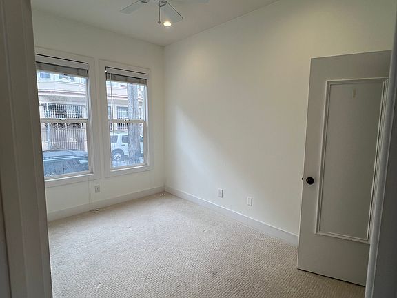 Front Bedroom w/ new carpet, large windows, closet, and ceiling fan