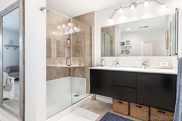 Master bath with double vanity being upgraded with quartzite counters, new faucets, new led mirror