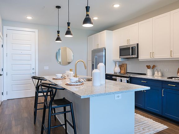 Custom Cabinetry with Under-Cabinet Lighting, Designer Hardware, and Tile Backsplashes
